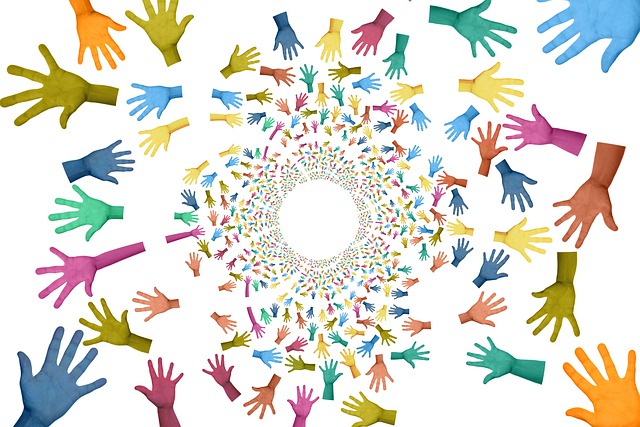 Graphic showing a circle of hands in different colors