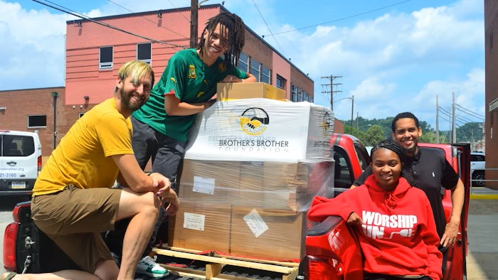 volunteers with a shipment of donations from Brother's Brother Foundation