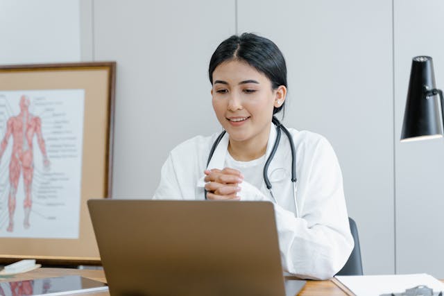 doctor using a laptop for telehealth appointment