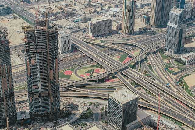 aerial view of city buildings and an interstate highway