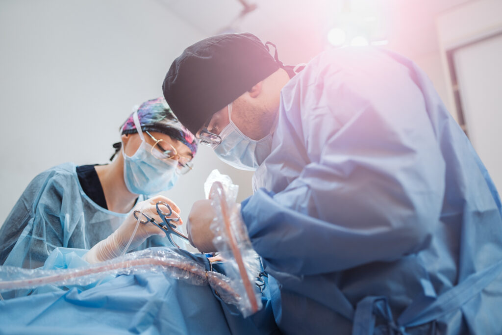 Portrait of doctor making surgery in operation theater. She is dressed in