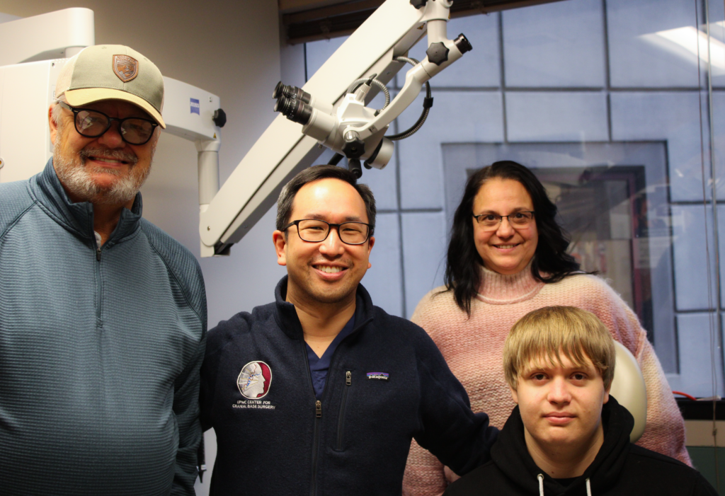 Brecken Peterson and his parents with Dr. Wang