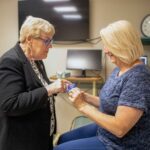 Susan with Dr. Whitney in the clinic
