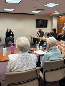 Workshop participants blowing into straws