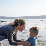 mother and son CI recipients on the beach