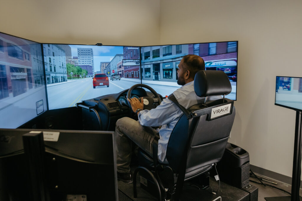 Clive D'Souza in the driving simulator