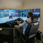 Clive D'Souza in the driving simulator