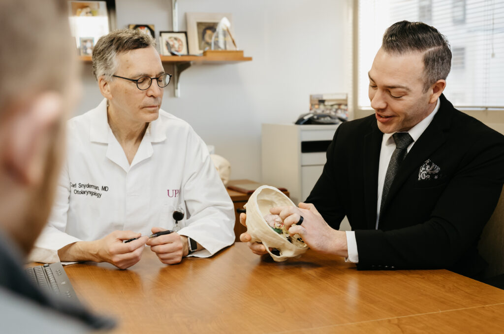 Drs. Snyderman and Choby looking at a 3D model