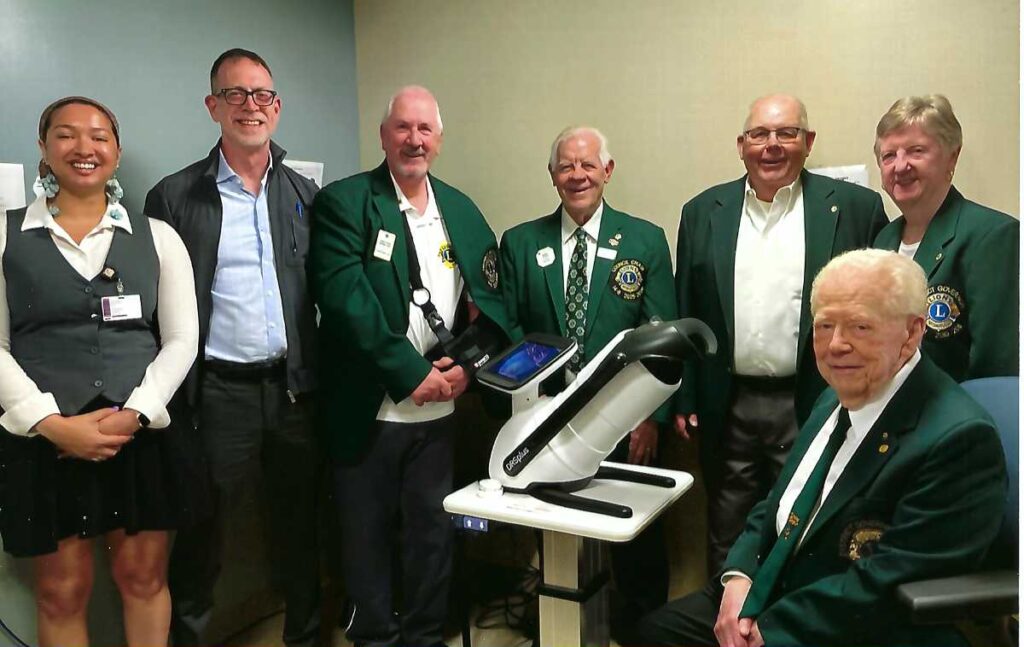 Zaila Hobson, Jake Waxman, and Lions Club members with the new camera