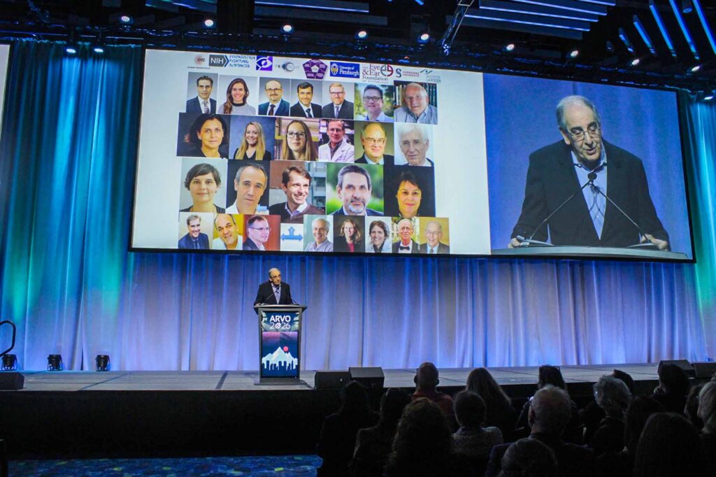 Dr. Sahel giving his speech, with a slide of people he's thanking