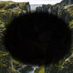 a picture of the outdoors in Iceland, with a black spot in the middle to signify what optic neuritis looks like