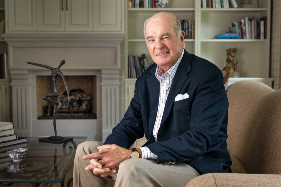 Marty McGuinn sitting on a chair in a living room