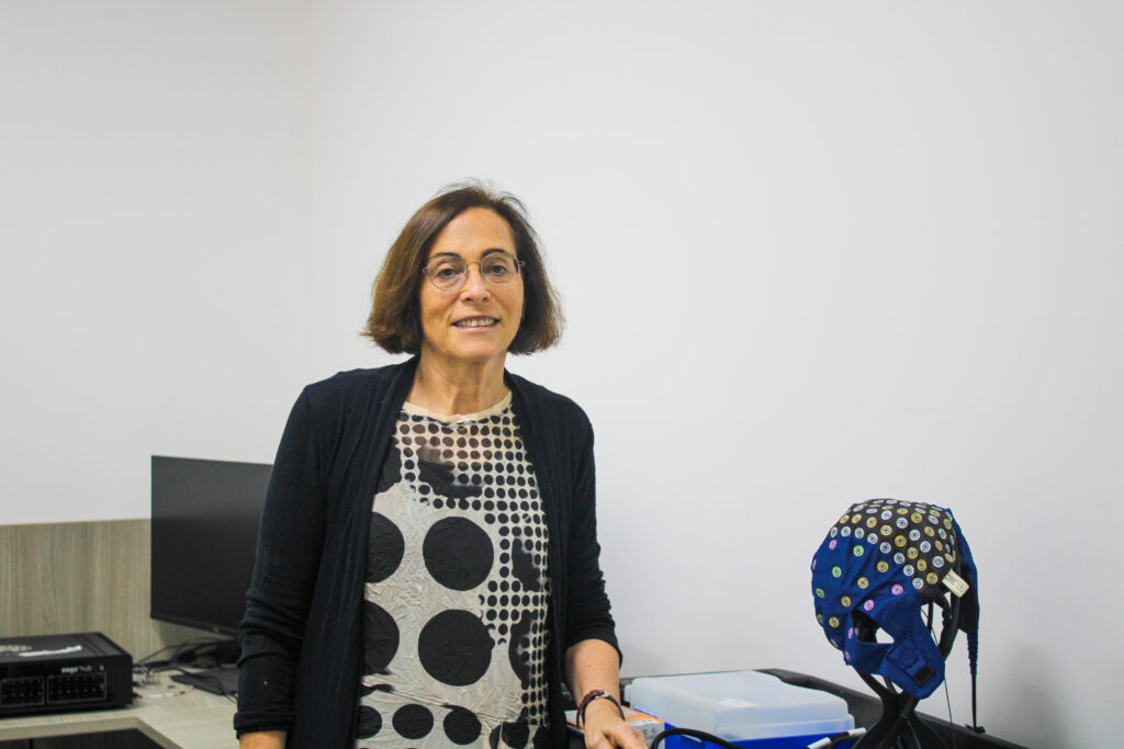 Marlene Behrmann next to one of her projects