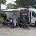 eyeVan on site, with one of the staff members waving
