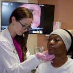 Dr. Chloe Santa Maria with a patient